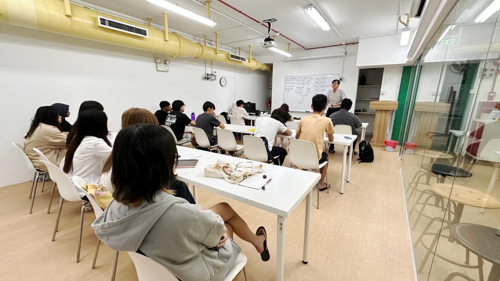 Humanities Tuition class in Singapore with students attending an interactive lesson led by an experienced tutor in a modern classroom.